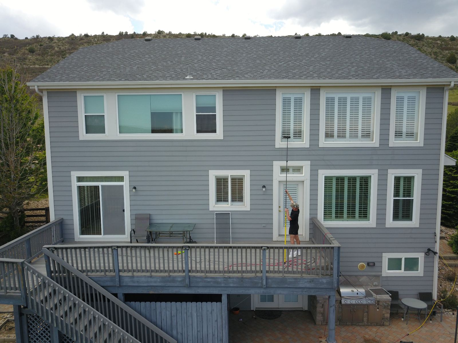 Aerial view — reaching upper-story windows with pure-water pole