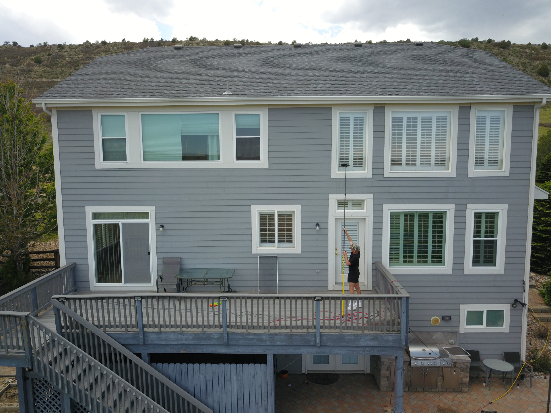 Aerial view — reaching upper-story windows with pure-water pole