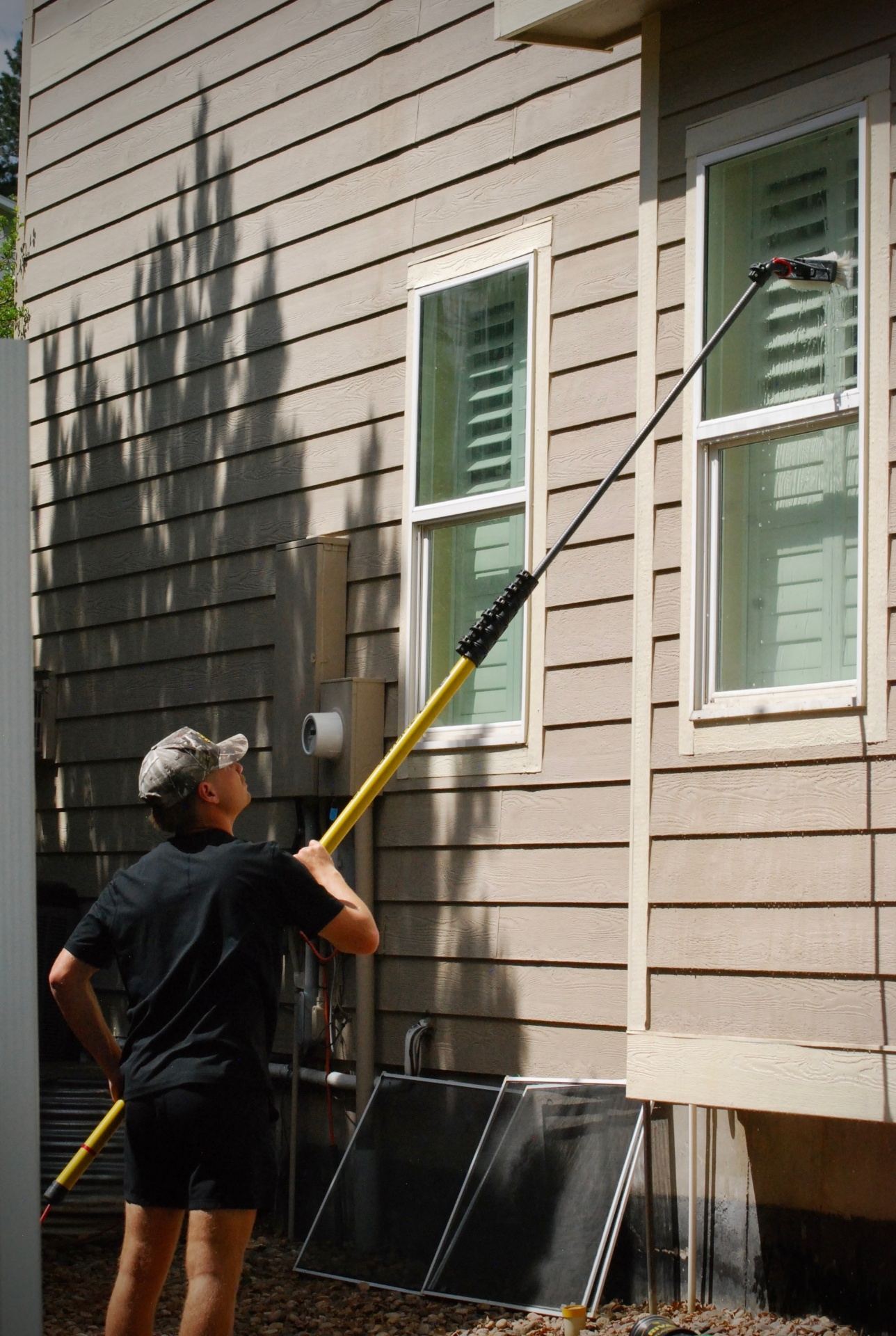 Pure-water pole system cleaning a second-story window